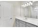 Modern bathroom with gray vanity and quartz countertop at 7139 Rose Hill Ave, Brownsburg, IN 46112