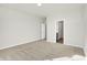 Well-lit bedroom featuring plush carpeting and en-suite bathroom at 7139 Rose Hill Ave, Brownsburg, IN 46112
