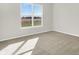 Light-filled bedroom with neutral carpet and a view at 7139 Rose Hill Ave, Brownsburg, IN 46112