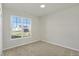 Spacious bedroom with large window and carpeted floor at 7139 Rose Hill Ave, Brownsburg, IN 46112