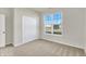 Bright bedroom with window and double door closet at 7139 Rose Hill Ave, Brownsburg, IN 46112