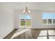 Dining area with chandelier and sliding glass doors to backyard at 7139 Rose Hill Ave, Brownsburg, IN 46112