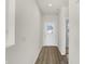 Bright entryway with light wood flooring and a white door at 7139 Rose Hill Ave, Brownsburg, IN 46112