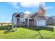 Ranch style home with gray siding, stone accents, and a spacious lawn at 7139 Rose Hill Ave, Brownsburg, IN 46112
