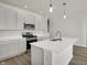 Modern kitchen with stainless steel appliances and an island at 7139 Rose Hill Ave, Brownsburg, IN 46112