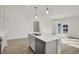 Modern kitchen with island and breakfast area at 7139 Rose Hill Ave, Brownsburg, IN 46112