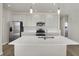 Modern kitchen with stainless steel appliances and an island at 7139 Rose Hill Ave, Brownsburg, IN 46112