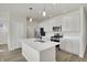 Modern kitchen with stainless steel appliances and an island at 7139 Rose Hill Ave, Brownsburg, IN 46112