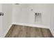 Bright laundry room with vinyl flooring and built-in utility space at 7139 Rose Hill Ave, Brownsburg, IN 46112
