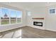 Bright living room with fireplace and large windows at 7139 Rose Hill Ave, Brownsburg, IN 46112