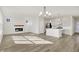 Open concept kitchen, dining, and living area with hardwood floors at 7139 Rose Hill Ave, Brownsburg, IN 46112