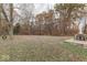 Spacious backyard with trees and a patio seating area at 8190 Beech Grove Rd, Martinsville, IN 46151