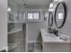 Modern bathroom with double vanity, large mirror, and walk-in shower at 8190 Beech Grove Rd, Martinsville, IN 46151