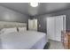 Main bedroom with a king-size bed and ensuite bathroom access at 8190 Beech Grove Rd, Martinsville, IN 46151