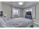 Bedroom with a full-size bed, gray walls, and a TV at 8190 Beech Grove Rd, Martinsville, IN 46151