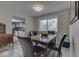 Cozy dining room with a view into the kitchen and a rustic wooden table at 8190 Beech Grove Rd, Martinsville, IN 46151