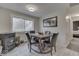 Charming dining area with a wood table, four chairs, and a wood-burning stove at 8190 Beech Grove Rd, Martinsville, IN 46151