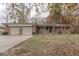 Brick ranch house with attached two-car garage and landscaped yard at 8190 Beech Grove Rd, Martinsville, IN 46151