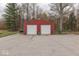 Red two-car garage with white doors at 8190 Beech Grove Rd, Martinsville, IN 46151