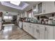 Updated kitchen featuring white cabinets, stainless steel appliances, and wood flooring at 8190 Beech Grove Rd, Martinsville, IN 46151
