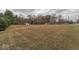 Large lot with open space, mature trees, and a red shed at 8190 Beech Grove Rd, Martinsville, IN 46151