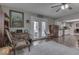 Bright living room features hardwood floors, a cozy sitting area, and access to the backyard at 8190 Beech Grove Rd, Martinsville, IN 46151