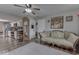Spacious living room with hardwood floors, a comfortable sofa, and views into the kitchen at 8190 Beech Grove Rd, Martinsville, IN 46151