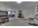Bright living area with hardwood floors, a sectional sofa, and views into the dining area at 8190 Beech Grove Rd, Martinsville, IN 46151