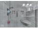 Walk-in shower with gray tile and built-in seat at 8190 Beech Grove Rd, Martinsville, IN 46151