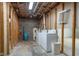 Unfinished basement with laundry hookups and storage at 908 Sprague St, Indianapolis, IN 46217