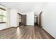 Spacious living room with hardwood floors and hallway access at 908 Sprague St, Indianapolis, IN 46217