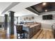 Impressive basement bar with granite countertops and a wine rack at 13613 Lake Ridge Ln, Fishers, IN 46055