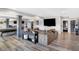 Finished basement with a large sectional sofa and a pool table at 13613 Lake Ridge Ln, Fishers, IN 46055