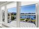 Spacious windows showcase a breathtaking view of the lake and surrounding landscape at 13613 Lake Ridge Ln, Fishers, IN 46055