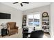 Home office with a large window offering water views and built-in shelving at 13613 Lake Ridge Ln, Fishers, IN 46055