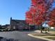 Community clubhouse with parking lot and vibrant fall foliage at 2327 Saddle Dr, Shelbyville, IN 46176