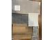 Selection of flooring, countertops, and paint samples for the home at 2327 Saddle Dr, Shelbyville, IN 46176