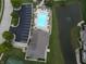 An overhead view of the community pool with lounge chairs and nearby pond at 2327 Saddle Dr, Shelbyville, IN 46176