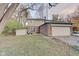Brick house with attached garage and a backyard patio at 4902 N Capitol Ave, Indianapolis, IN 46208