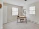 Bright bedroom featuring a workspace with a desk and chair, plus two windows at 4902 N Capitol Ave, Indianapolis, IN 46208
