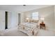 Well-lit bedroom with a double bed and built-in closet at 4902 N Capitol Ave, Indianapolis, IN 46208