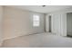 Simple bedroom with neutral walls and carpet flooring at 4902 N Capitol Ave, Indianapolis, IN 46208