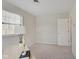 Spacious bedroom with a small workspace and an adjacent door at 4902 N Capitol Ave, Indianapolis, IN 46208