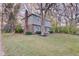 Side view of a two-story house with brick and siding, and mature trees at 4902 N Capitol Ave, Indianapolis, IN 46208