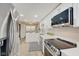 Modern kitchen with white cabinets, stainless steel appliances, and a breakfast bar at 4902 N Capitol Ave, Indianapolis, IN 46208