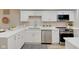 Modern kitchen with white cabinets, stainless steel appliances, and quartz countertops at 4902 N Capitol Ave, Indianapolis, IN 46208