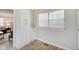 Laundry room with white cabinets, wood flooring, and a window with blinds at 4902 N Capitol Ave, Indianapolis, IN 46208
