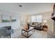 Bright living room features a cozy sofa, fireplace, and hardwood floors at 4902 N Capitol Ave, Indianapolis, IN 46208