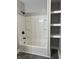 Bathroom with a bathtub, shower, and built-in shelving at 503 E Clyde St, Frankton, IN 46044