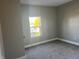 Bright bedroom featuring grey walls and carpeted floors at 503 E Clyde St, Frankton, IN 46044